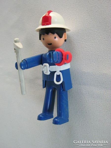 Retro plastic toy figurine firefighter