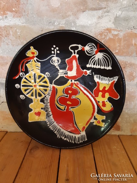 Craftsman with ceramic plate