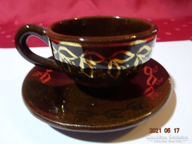 Chocolate brown glazed ceramic coffee cup + placemat. He has!