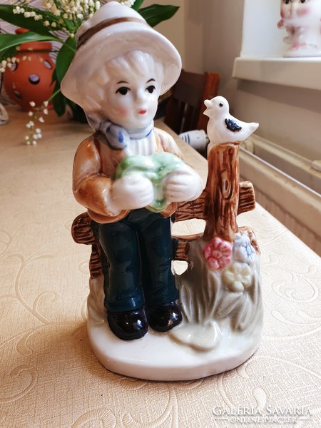 Antique porcelain figurine, little boy with bird for sale!
