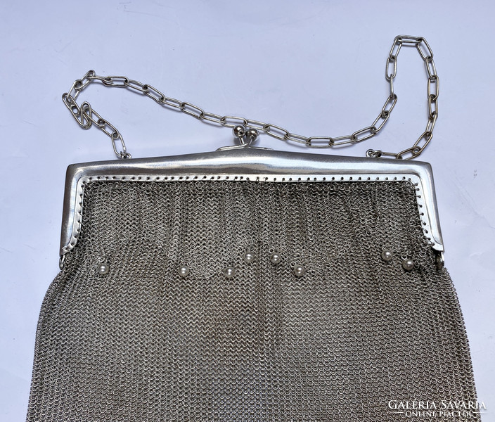Silver-plated theater bag.