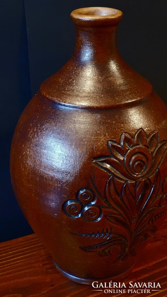 Old, brown, engraved, large ceramic jug or vase.