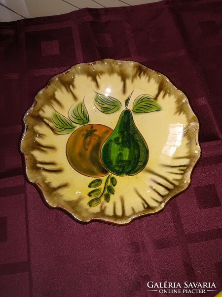 Old hand-painted ceramic bowl, dry center