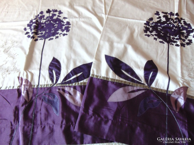 A pair of beautiful purple cream blackout curtains