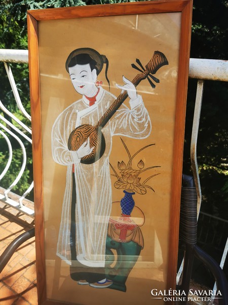 Chinese woman playing musical instrument