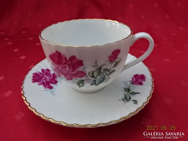 Chinese porcelain, rose patterned teacup + placemat. He has!