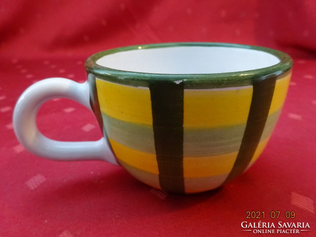 Glazed ceramic hand-painted teacup with checkered pattern. He has!