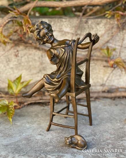 Little girl playing with a cat - bronze sculpture works of art