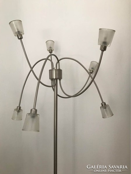 Minimalist metal standing lamp with movable arms and thick-walled opal shades