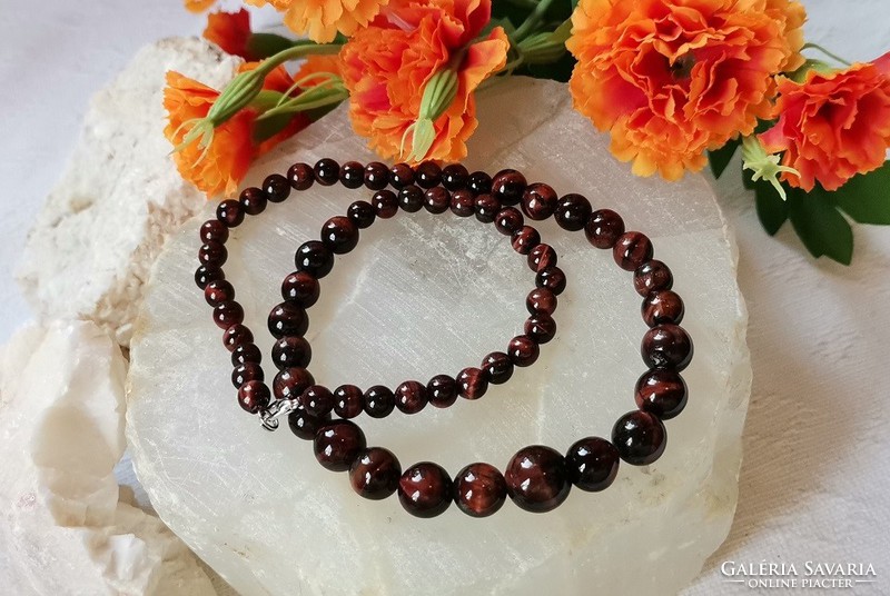 Real room. Red tiger eye necklace made of growing eyes, topaaa quality