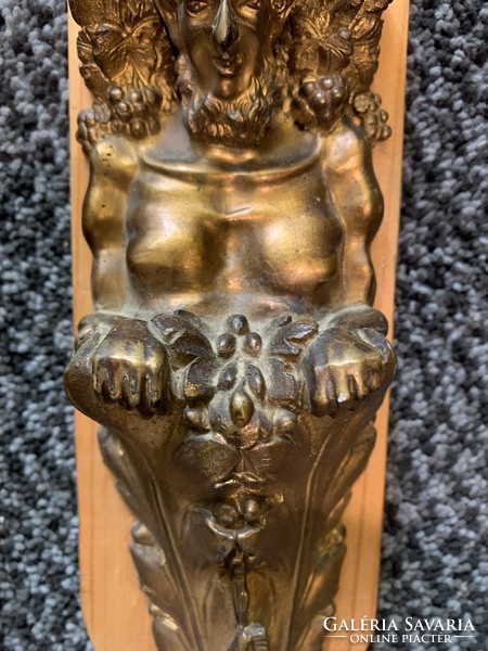 Furniture decoration with a bronze devil's head (there is only one left)