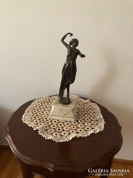 Antique bronze dancing girl on pedestal