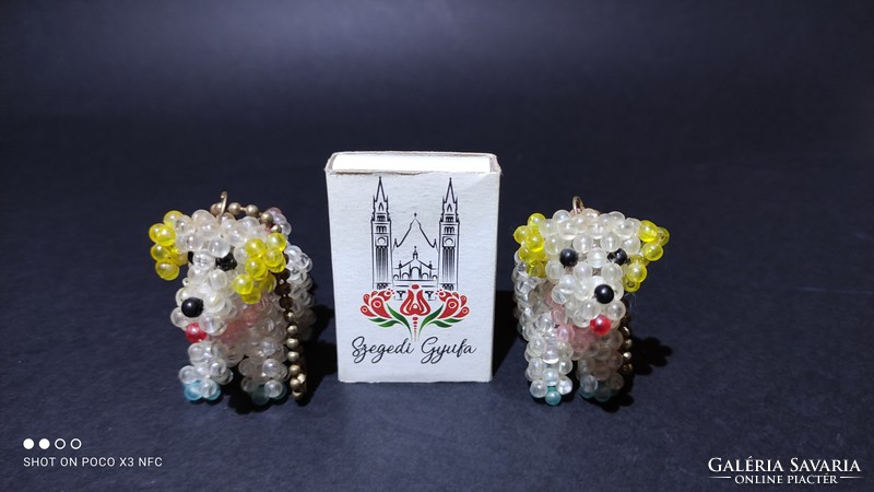 Two tiny pearl doggy dog keychains