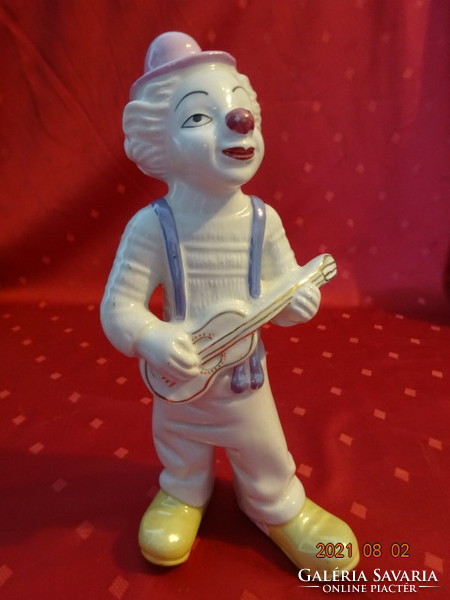 German porcelain figure, musical clown with guitar, height 25 cm. He has!