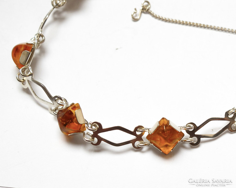 Silver bracelet with amber stones. Fischlandschmuck company.