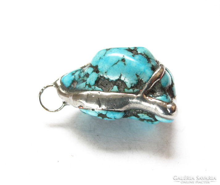 Handcrafted turquoise stone pendant.