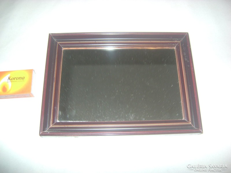 Small wall mirror with wooden frame, shaving mirror