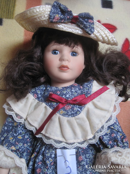 Charming, marked porcelain doll from the pomenade collection. 3.