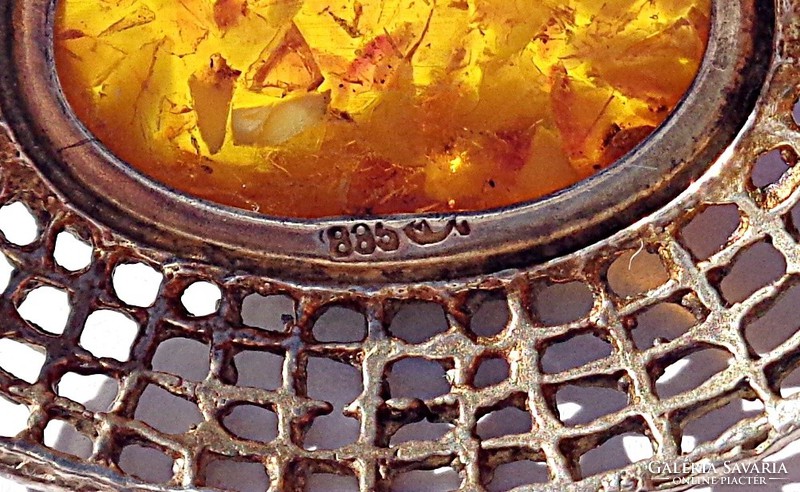 Amber stone pendant with openwork pattern in 835 silver frame