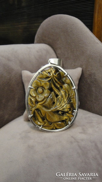 Antique silver pendant with carved tiger eyes