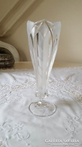 A beautiful etched crystal vase with a foot