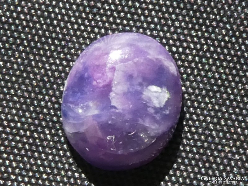 A small gemstone polished from a combination of natural sigilite and richterite. Jewelry base material 2.85 ct