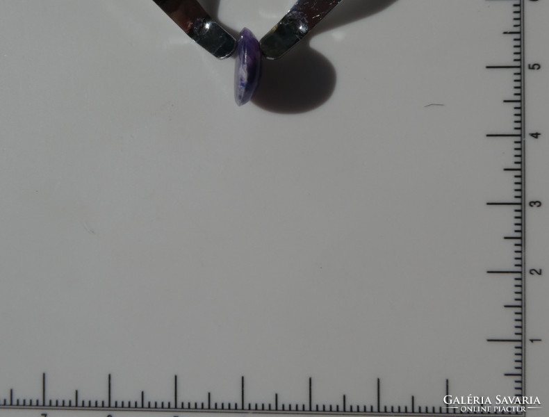 A small gemstone polished from a combination of natural sigilite and richterite. Jewelry base material 2.85 ct