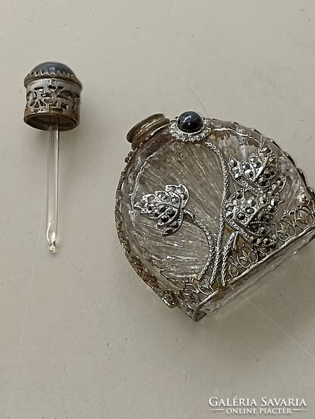 Old bottle of perfume or cologne with a pipette decorated with onyx stone and marcasite