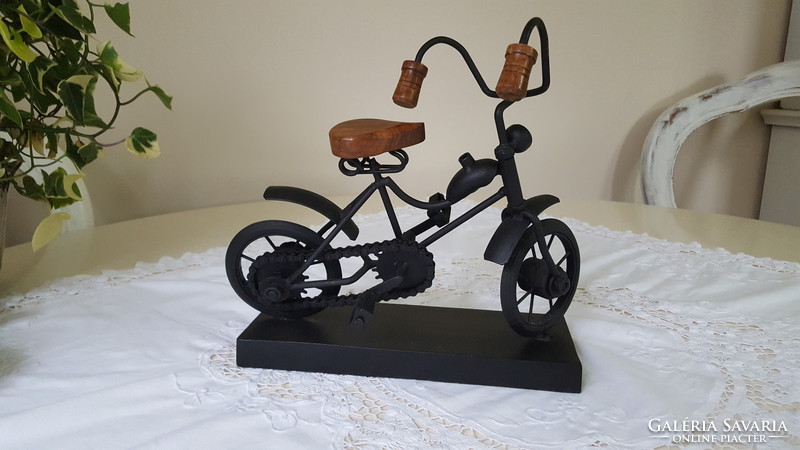 Marks & spencer design, metal bicycle mockup on wooden pedestal