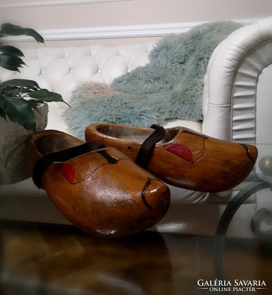 Dutch wooden slippers, old wooden lamp, traditional hand-carved beech shoes