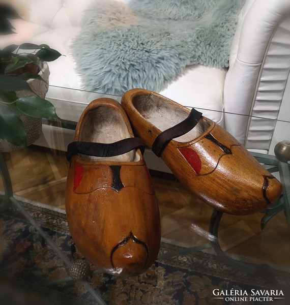 Dutch wooden slippers, old wooden lamp, traditional hand-carved beech shoes