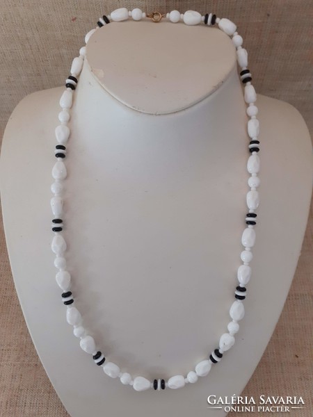 Retro long white porcelain necklace between one with black eyes
