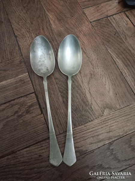 Two pieces marked with antique alpaca spoons