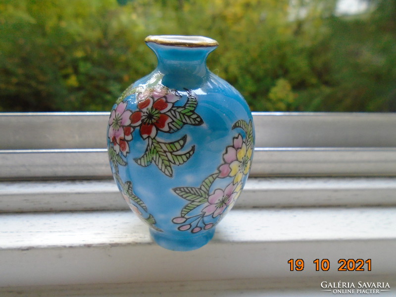 Small turquoise blue Chinese vase with hand painted colorful floral patterns