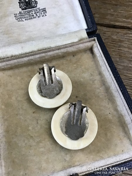 Beautiful clip-on earrings made of old fangs
