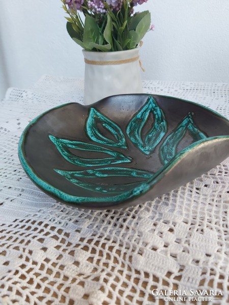 Retro d. Signed leaf-shaped ceramic table top offering collectible nostalgia pieces from mid-century modern