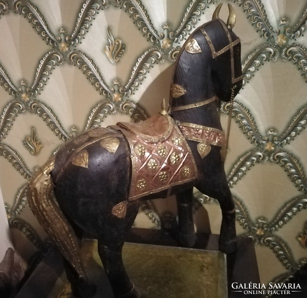 Antique wooden horse with copper decoration
