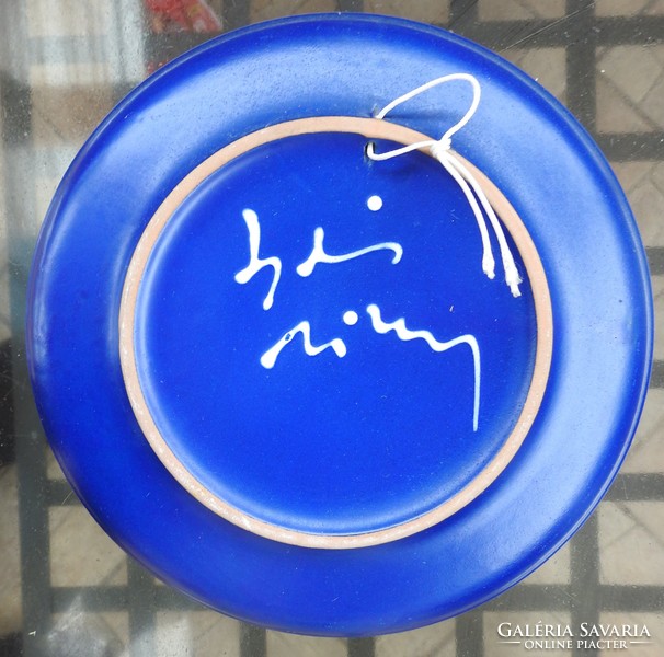 Bird pattern on blue ceramic wall plate - marked