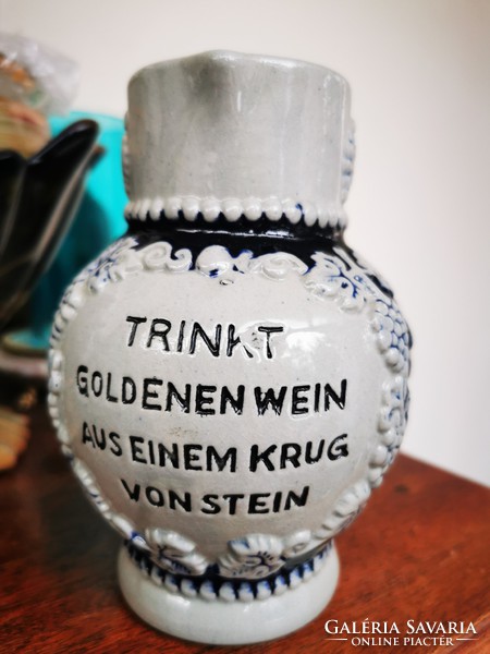 German wine jug with bunch of grapes
