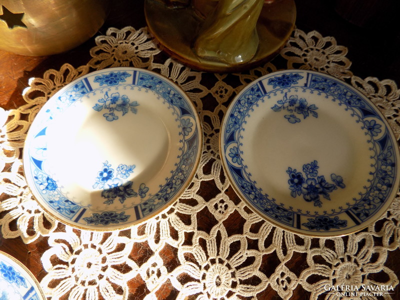 Two small cups with three plates