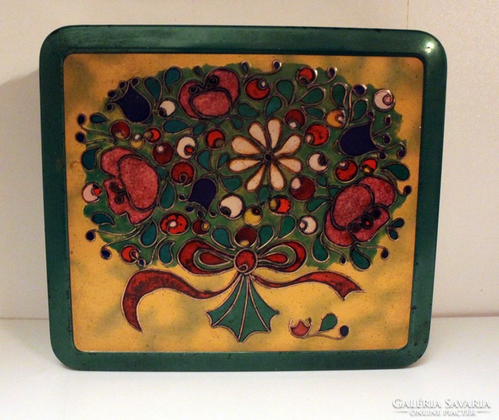 Old metal box with bouquet of green flowers