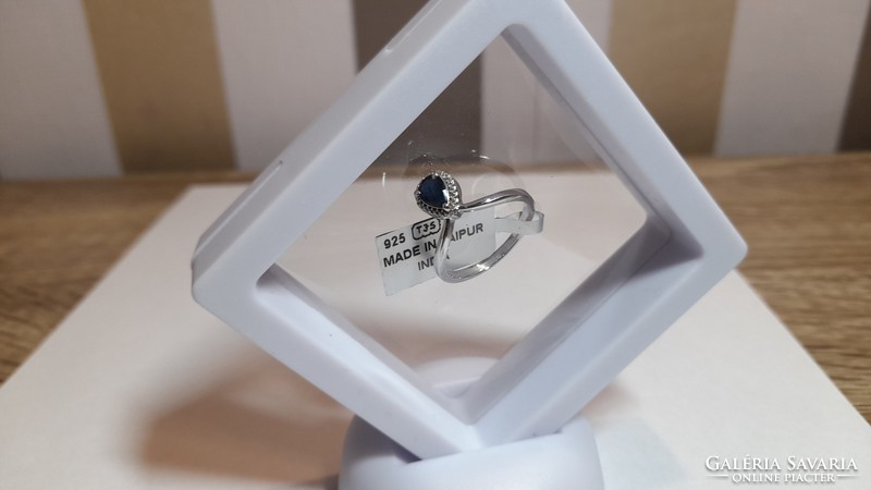 Silver ring with diamonds and blue sapphires