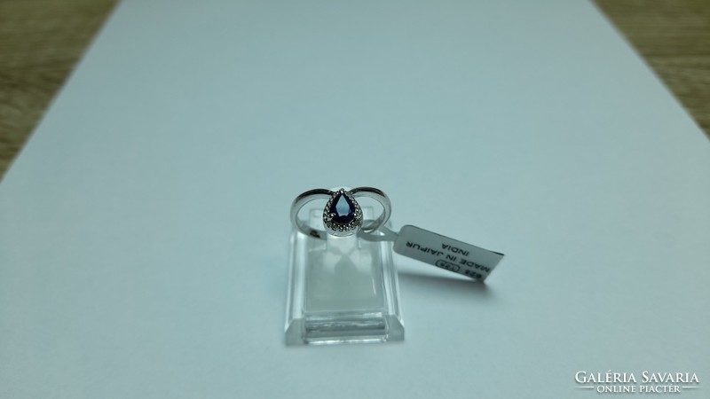 Silver ring with diamonds and blue sapphires