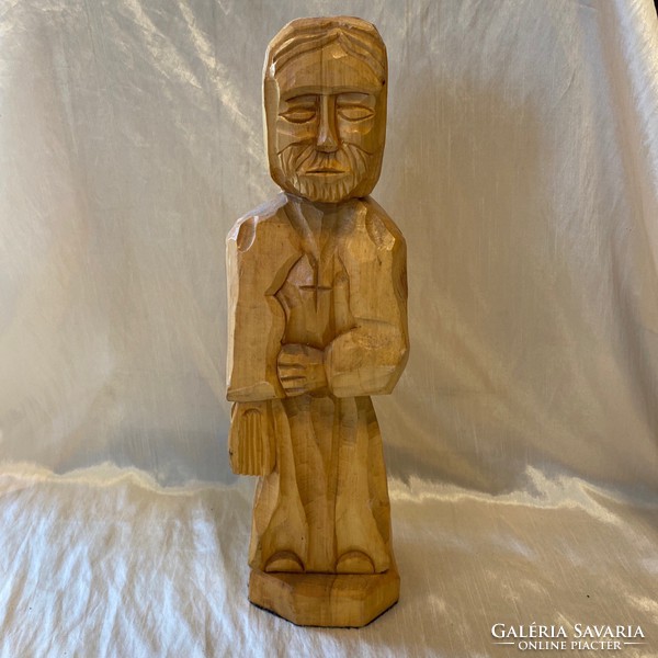 A huge wood carving depicting a saint