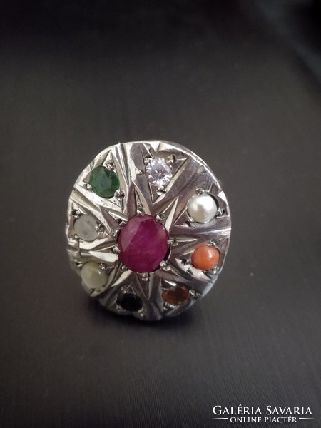 Silver ring with precious stones