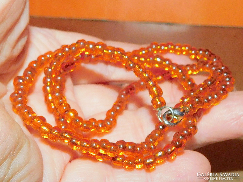 Delicate necklace with amber glass beads