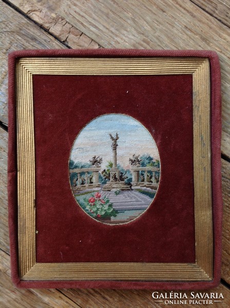 Antique needle tapestry in a velvet frame