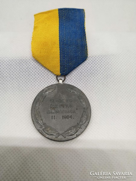 Old sports medal with chest strap 1964