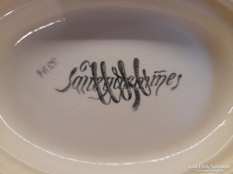 Bowl of sarreguemines sauce with spoon