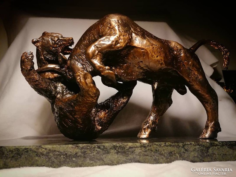 Bear-bull fight bronze statue of bull and bear